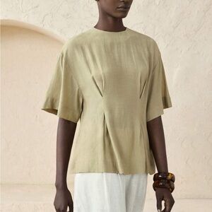 Light green cinched pleated waist tapered short sleeve flowy peplum top